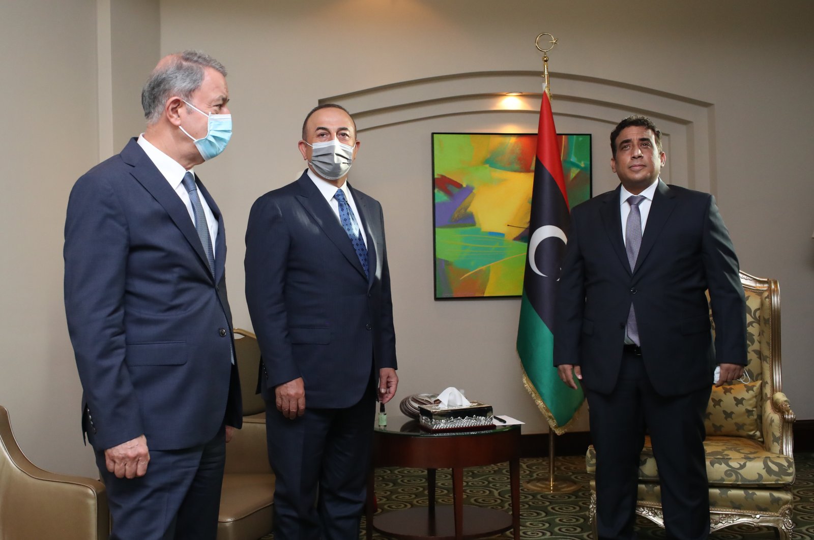 From left to right, Defense Minister Hulusi Akar, Foreign Minister Mevlüt Çavuşoğlu and head of Libya's Presidential Council, Mohammad Younes Menfi meet in Tripoli, Libya, May 3, 2021. (AA Photo)