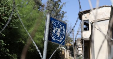 A United Nations sign is seen through barbed wire at the U.N.-controlled buffer zone in Nicosia (Lefkoşa), Cyprus April 28, 2021. (REUTERS Photo)