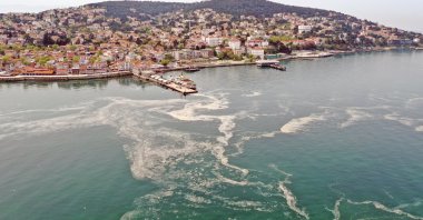 The sea snot is seen in this aerial picture taken near the pier of Büyükada, the largest of Istanbul's Princes Islands, in the Marmara sea, Turkey, May 2, 2021. (AA Photo)