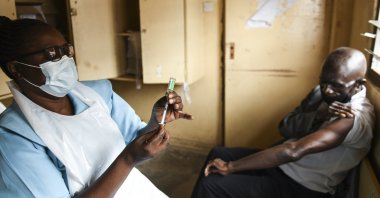 In this Monday, March 29, 2021 file photo, a man prepares for his AstraZeneca COVID-19 vaccine at Ndirande Health Centre in Blantyre, Malawi. (AP Photo)