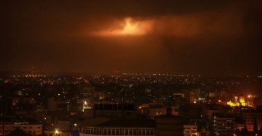 Lighting bombs fired by the Israeli army can be seen through the clouds after the Palestinian protests in Gaza City, Palestine, April 24, 2021. (Photo  by Getty Images)