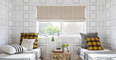 This image released by Portland Oregon-based interior designer Max Humphrey shows a room with a wallpaper design inspired by bandanas. (Christopher Dibble via AP)