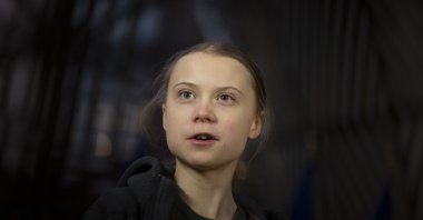 Swedish teenage activist Greta Thunberg speaks with the media as she arrives for a meeting of the Environment Council at the European Council building in Brussels, Belgium, March 5, 2020. (AP File Photo)