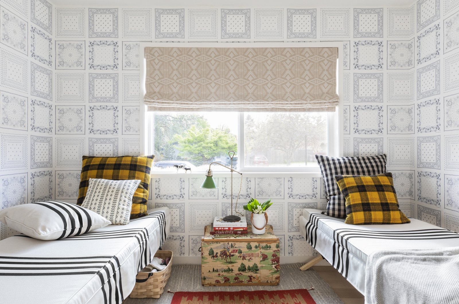 This image released by Portland Oregon-based interior designer Max Humphrey shows a room with a wallpaper design inspired by bandanas. (Christopher Dibble via AP)