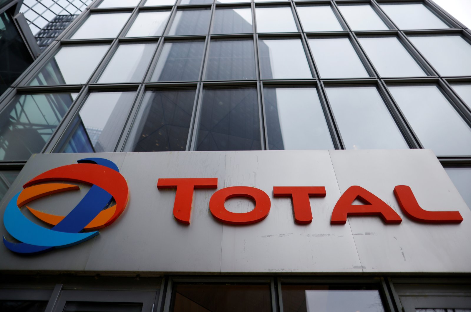 The logo of French oil and gas company Total is seen at La Defense business district in Courbevoie near Paris, France, February 8, 2021. (Reuters Photo)