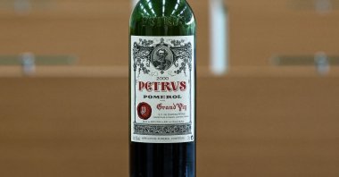 A bottle of Petrus that went into space is displayed at the University of Bordeaux Institut des Sciences de la Vigne et du Vin (Institute of Vine & Wine Science) in Villenave-d'Ornon, on the outskirts of Bordeaux, southwestern France, March 1, 2021. (AFP Photo)