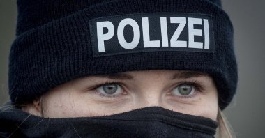A German police officer stands guard at the train station in Biblis, Germany, Nov. 4, 2020. (AP Photo)