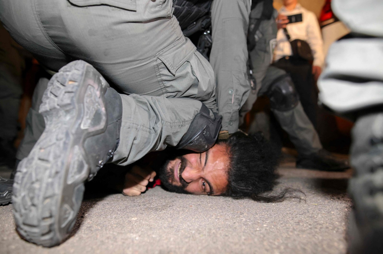 Israeli security forces detain a Palestinian man amid ongoing confrontations as Palestinian families face eviction in the Sheikh Jarrah neighbourhood of East Jerusalem, occupied Palestine, on May 4, 2021. (AFP Photo)