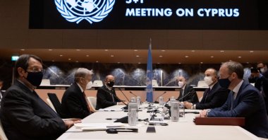 United Nations Secretary-General Antonio Guterres, Greek Cypriot leader Nicos Anastasiades, Turkish Cypriot leader Ersin Tatar, British Foreign Secretary Dominic Raab,Turkish Foreign Minister Mevlüt Çavuşoğlu and Greece's Foreign Minister Nikos Dendias talk during a meeting at the United Nations European headquarters in Geneva, Switzerland, April 29, 2021 (Reuters Photo)