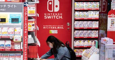 A customer browses the gaming section of Nintendo products in a shop in Tokyo, Japan, May 6, 2021. (AFP Photo)
