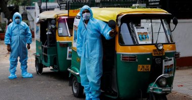 Drivers stand near autorickshaw ambulances, prepared to transfer people suffering from the coronavirus and their relatives for free, in New Delhi, India, May 5, 2021. (Reuters / Adnan Abidi Photo)