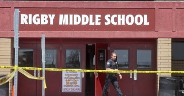 A police officer walks out of Rigby Middle School following a shooting there earlier, in Rigby, Idaho, U.S., May 6, 2021. (AP Photo)