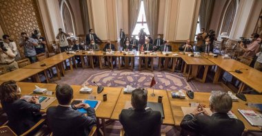 Egypt's Deputy Foreign Minister Hamdi Sanad Loza (background) meets with his Turkish counterpart Sedat Önal (Foreground) in the foreign ministry headquarters in Cairo, Egypt, May 5, 2021. (AFP Photo)