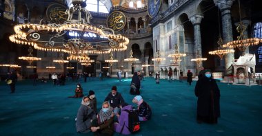 Russian tourists pause as they visit Ayasofya-i Kebir Camii, also known as the Hagia Sophia Grand Mosque, amid the coronavirus disease outbreak in Istanbul, Turkey, Jan. 29, 2021. (Reuters Photo)