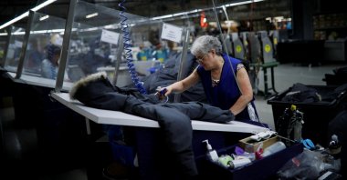 Workers make jackets at the Canada Goose factory in Toronto, Ontario, Canada, February 23, 2018. (Reuters Photo) 