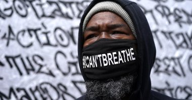Kenneth Holt, 48, looks on as he visits George Floyd Square a day after former Minneapolis police Officer Derek Chauvin was convicted on all counts for the 2020 death of Floyd, Wednesday, April 21, 2021, in Minneapolis.  (AP Photo)