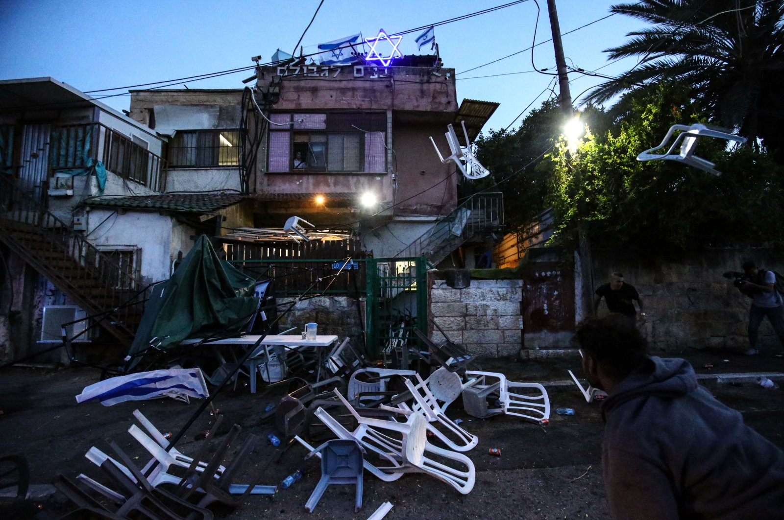 Scattered plastic chairs seen after clashes between Palestinians and Israeli settlers in the Sheikh Jarrah neighborhood, East Jerusalem, May 6, 2021. (AA Photo)