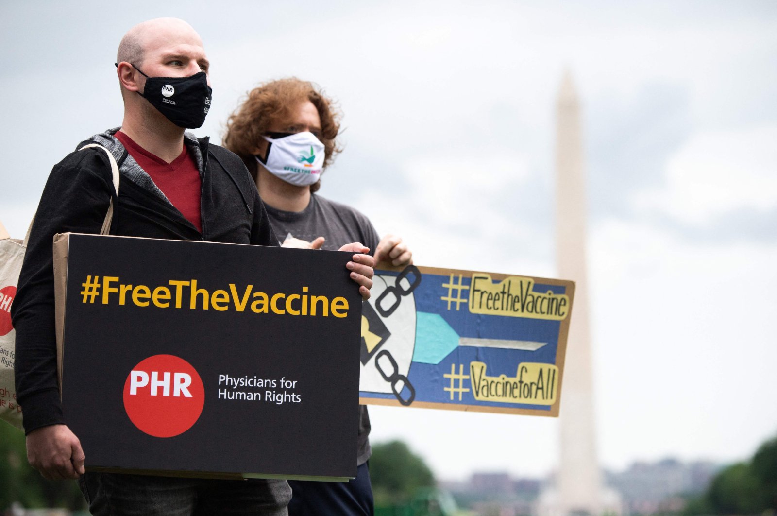Demonstrators hold a rally to "Free the Vaccine," calling on the U.S. to commit to a global coronavirus vaccination plan that includes sharing vaccine formulas with the world to help ensure that every nation has access to a vaccine, on the National Mall in Washington, D.C., U.S., May 5, 2021. (AFP Photo)