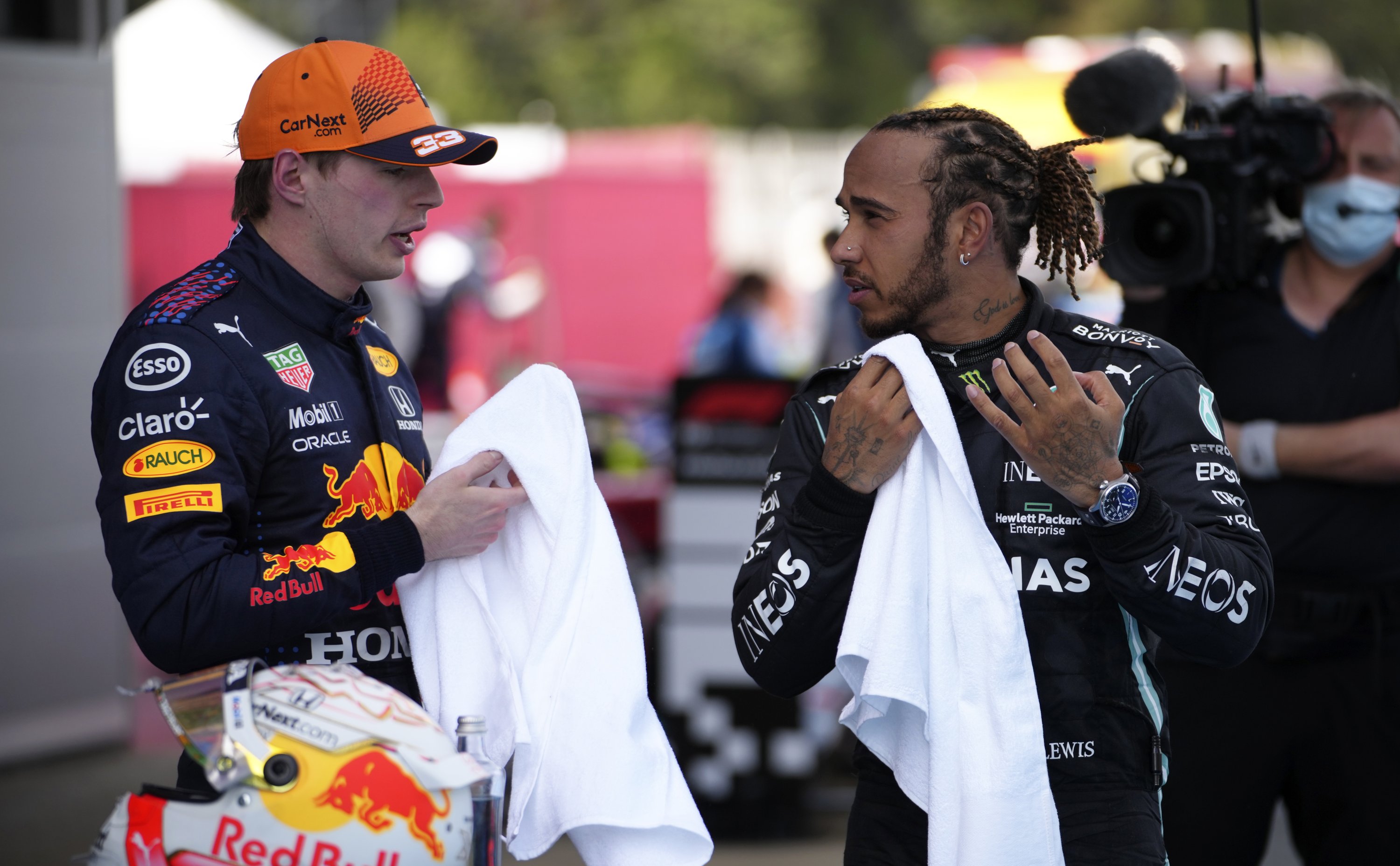 Mercedes driver Lewis Hamilton (R) talks with second placed Red Bull driver Max Verstappen (L), after winning the Spanish Formula One Grand Prix at the Barcelona Catalunya racetrack in Montmelo, Barcelona, Spain, May 9, 2021. (AP Photo)
