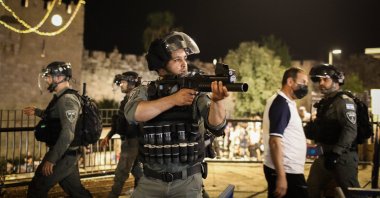An Israeli police officer holds a gun during Palestinian demonstrations against the forced evictions from the Sheikh Jarrah neighborhood, occupied East Jerusalem, Palestine, May 8, 2021. (Photo by Getty Images)