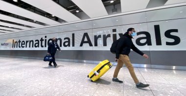 Travelers at Heathrow Airport, London, U.K., Feb. 13, 2021. (Reuters Photo)