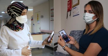 Selma Can (L) and Özlem Tekin, nurses working at hospitals in Malatya and Mardin respectively, make video calls to their children, Turkey, May 9, 2021. (AA PHOTO)
