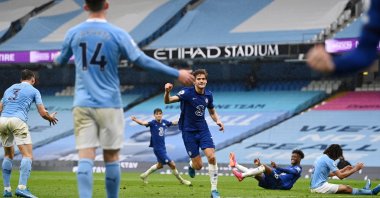 Chelsea's Marcos Alonso celebrates scoring a goal against Manchester City at the Etihad Stadium, Manchester, Britain, May 8, 2021.