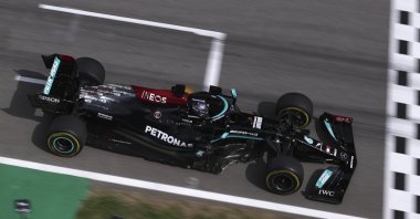 British Mercedes driver Lewis Hamilton crosses the finish line to win the Spanish Formula One Grand Prix at the Barcelona Catalunya racetrack in Montmelo, just outside Barcelona, Spain, May 9, 2021. (AP Photo)