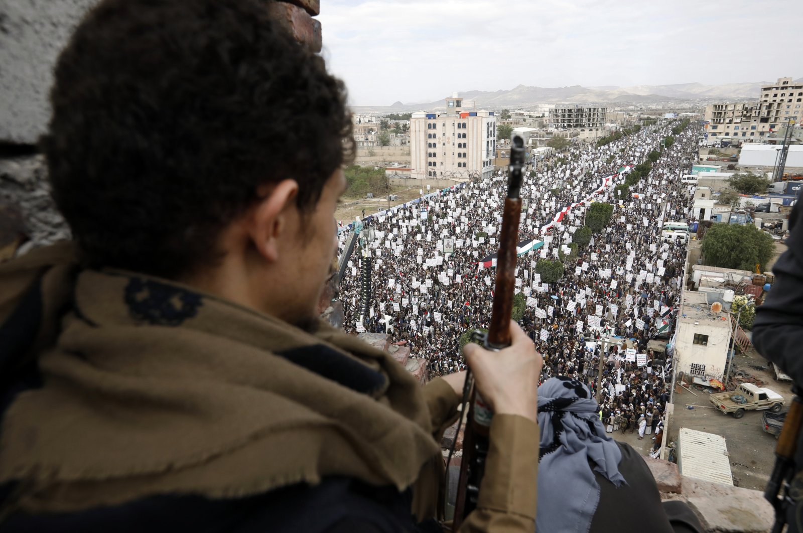 An armed Houthi fighter keeps watch as Houthi supporters attend a rally marking Al-Quds Day (Jerusalem Day) on the last Friday of the Muslim fasting month of Ramadan, Sanaa, Yemen, May 7, 2021. (EPA Photo)