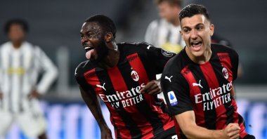 AC Milan's Fikayo Tomori (L) celebrates with teammate Diogo Dalot after scoring his side's third goal against Juventus in a Serie A game at Allianz Stadium, Turin, Italy, May 9, 2021.