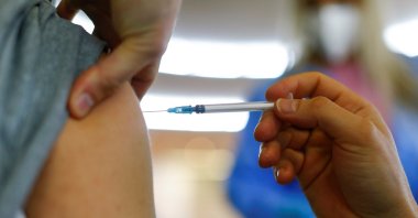 A person receives a dose of the Pfizer-BioNTech COVID-19 vaccine in the Central Mosque in the suburb of Ehrenfeld in Cologne, Germany, May 8, 2021. (Reuters Photo)