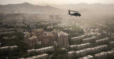 A U.S. Air Force Black Hawk helicopter is pictured in front of the cityscape, in Kabul, Afghanistan, April 29, 2021. (Photo by Getty Images)