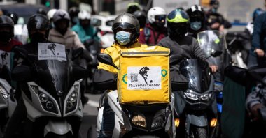 A group of delivery riders protests against the law approved by the government's Cabinet that regulates their activity in Madrid, Spain, May 11, 2021. (EPA Photo)