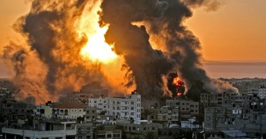 A fire rages at sunrise following an Israeli airstrike in Khan Yunish, southern Gaza Strip, Palestine, May 12, 2021. (AFP Photo)