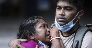 A Bangladeshi woman mourns the death of her husband who died of COVID-19 at a hospital in Dhaka, Bangladesh, May 7, 2021. (Mahmud Hossain Opu via AP)