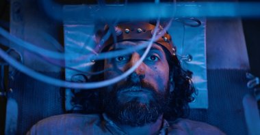 Actor Numan Acar in a scene from “Gölgeler İçinde” (“In the Shadows”).