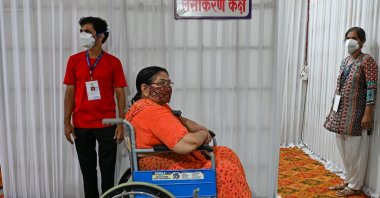 An elderly woman waits to get inoculated with a COVID-19 vaccine, at a vaccination center in Mumbai, India, May 12, 2021. (AFP Photo)