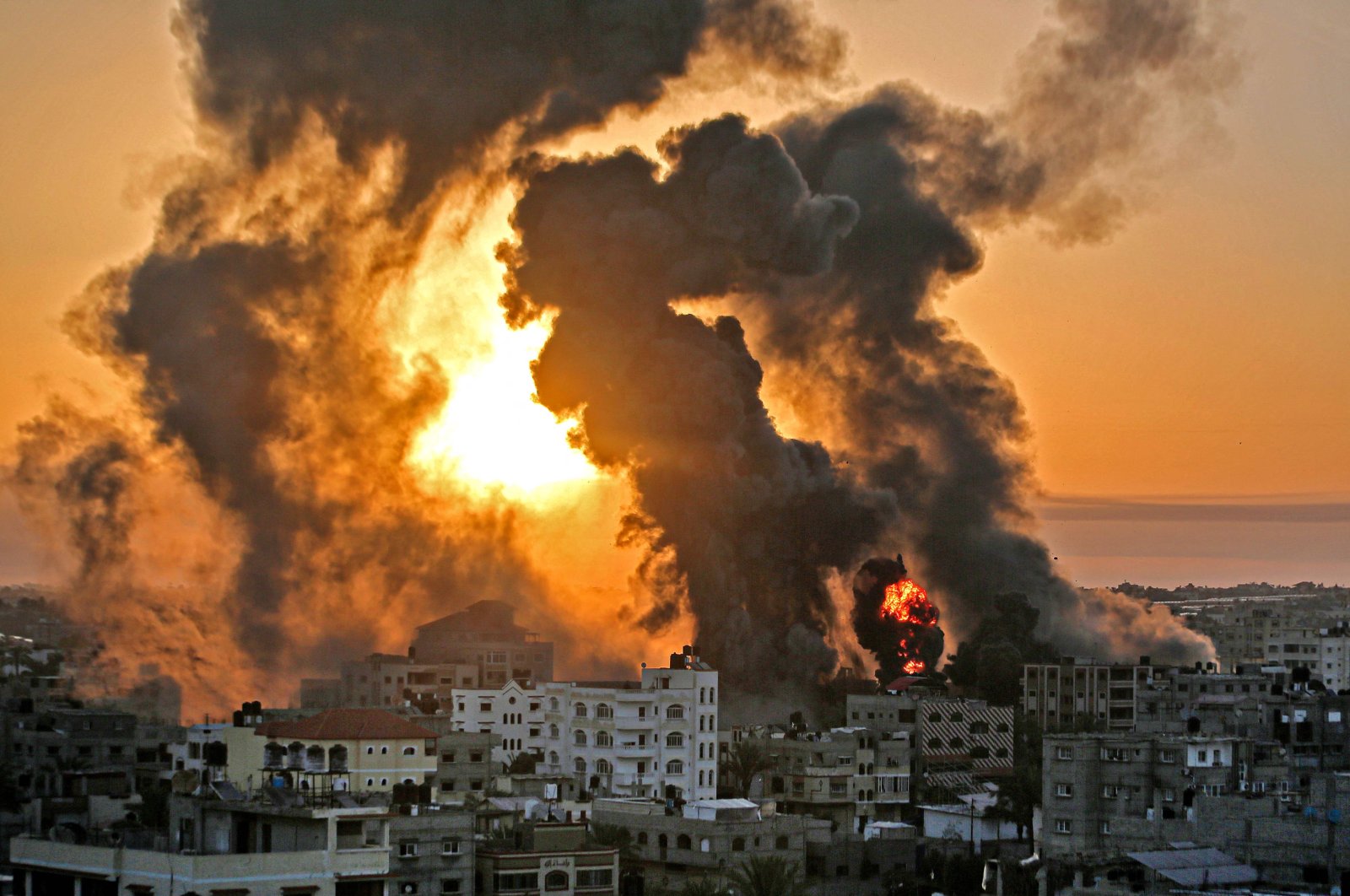 A fire rages at sunrise following an Israeli airstrike in Khan Yunish, southern Gaza Strip, Palestine, May 12, 2021. (AFP Photo)