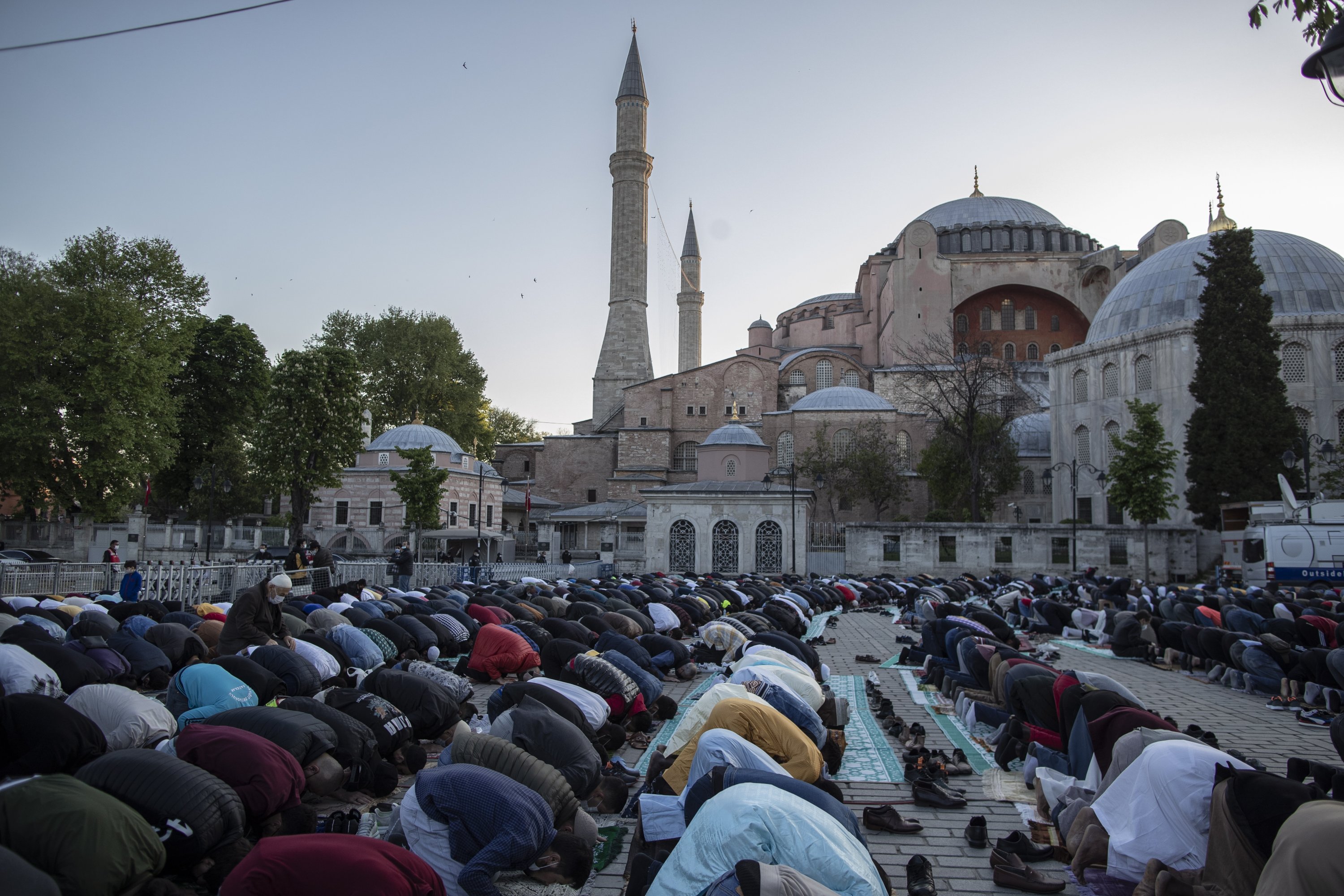 Muslims offer prayers during the first day of Eid al-Fitr, which marks the end of the holy month of Ramadan, outside the Hagia Sophia Grand Mosque in the historic Sultanahmet district of Istanbul, Turkey, May 13, 2021. (AP Photo)