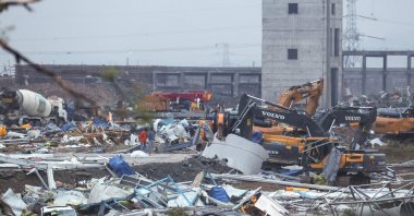 Damaged vehicles and debris are pictured at a construction site after a tornado hit an economic zone in Wuhan, central Hubei province, China, May 15, 2021. (AFP Photo)