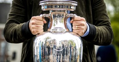 The Henri Delaunay trophy of the UEFA Euro 2020 is presented on the Magere Bridge in Amsterdam, The Netherlands, May 14, 2021.  (EPA Photo)