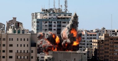 A ball of fire erupts from the Jala Tower as it is destroyed in an Israeli airstrike in Gaza City, Palestine, May 15, 2021. (AFP Photo)