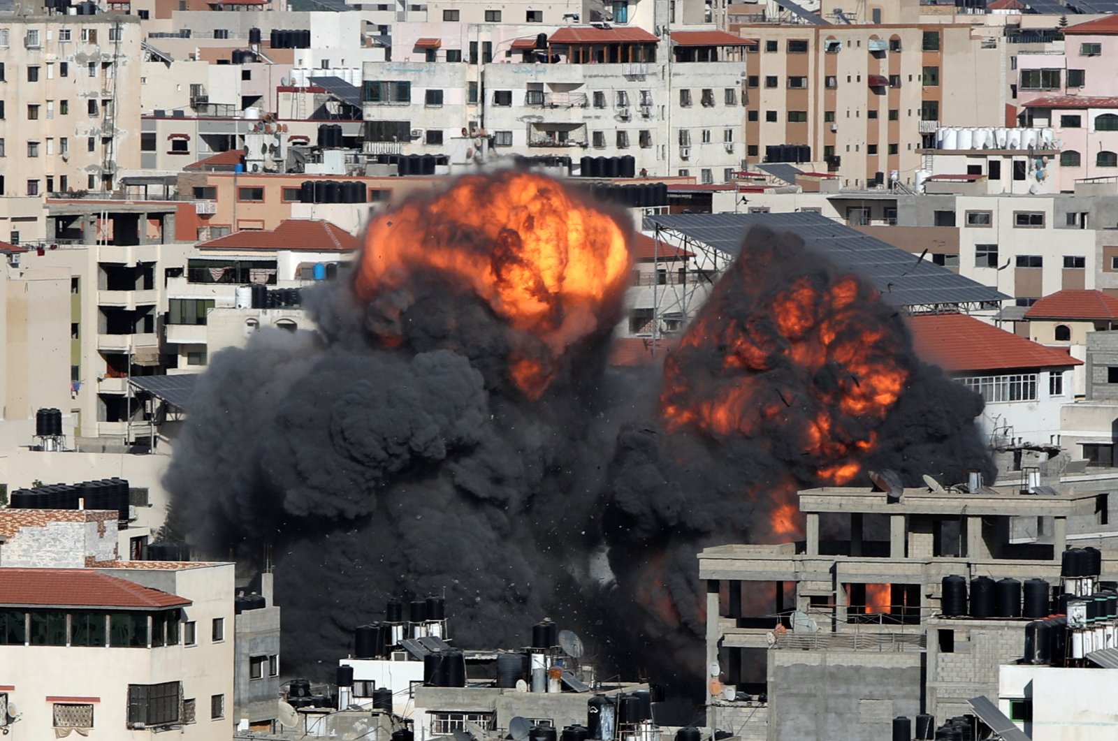 Smoke and flames rise during an Israeli airstrike on Gaza City, Palestine, May 14, 2021. (Reuters Photo)