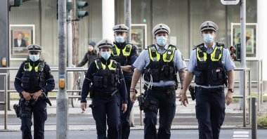 Police secure a court in Dusseldorf, Germany, April 29, 2021. (AP Photo)