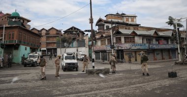 Indian paramilitary forces stand on alert during COVID-19 restrictions on the eve of Ramadan Bayram, also known as Eid al-Fitr, in Srinagar, India-controlled Kashmir, May 13, 2021. (Photo by Getty Images)