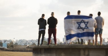 Israelis gather to watch the Iron Dome missile defense system intercept rocket fire amid Israeli attacks against Gaza, in Ashdod, Israel, May 17, 2021. (Photo by Getty Images)