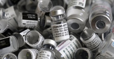 Empty vials of the Pfizer-BioNTech COVID-19 vaccine lie in a box during a vaccine campaign at the Vaccine Village in Ebersberg near Munich, Germany, May 15, 2021. (AP Photo)