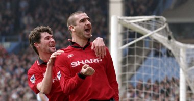 Manchester United's Eric Cantona (R) celebrates his goal with teammate Roy Keane during the Premier League football match between Manchester City and Manchester United at the Maine Road in Manchester, England, April 6, 1996. (Action Images/Darren Walsh via Reuters)