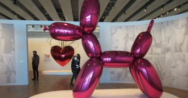 Jeff Koons' "Balloon Dog" is seen in the foreground while his "Hanging Heart" is in the background at the Mucem, Marseille, France. (DPA Photo)