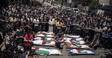 Palestinians attend the funeral of two women and eight children of the Abu Hatab family who were killed after an Israeli airstrike in Gaza City, Gaza Strip, Palestine, May 15, 2021. (AP Photo)
